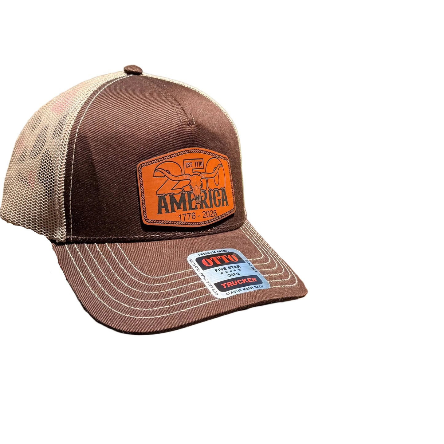 A brown and beige trucker hat with an orange 'AMERICA' patch.