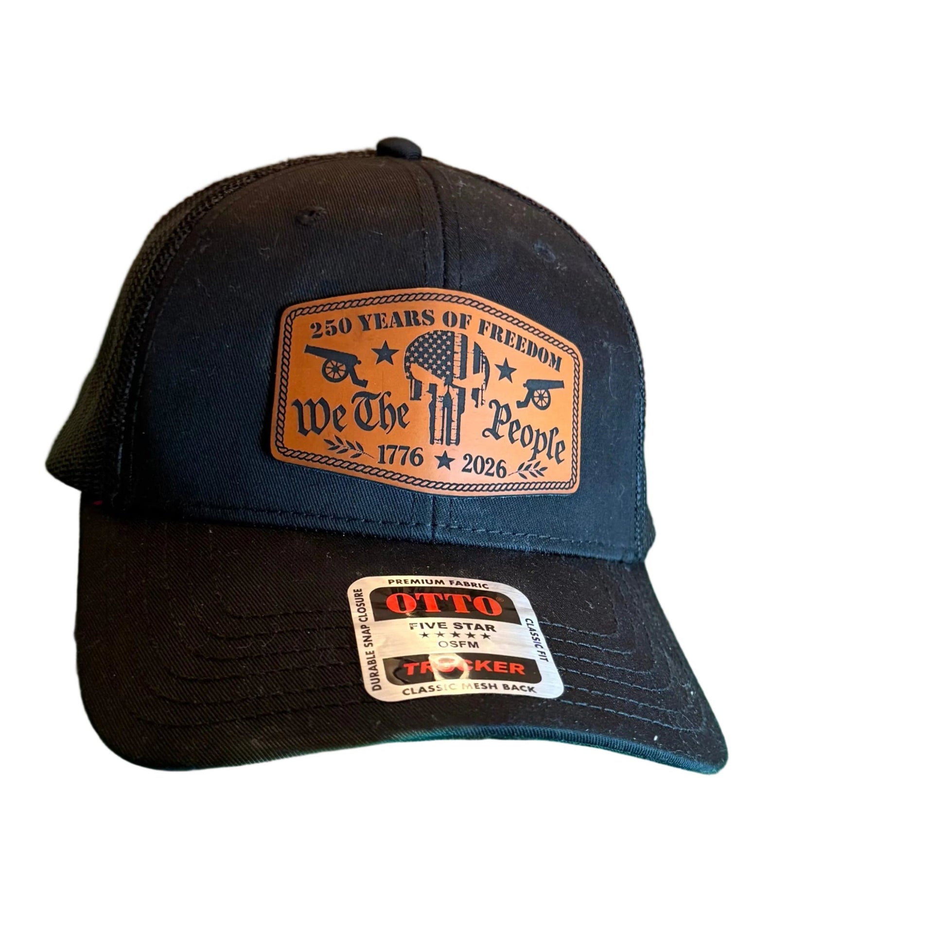 A black snapback cap with a brown leather patch reading '260 Years of Freedom We The People 1776 2025.