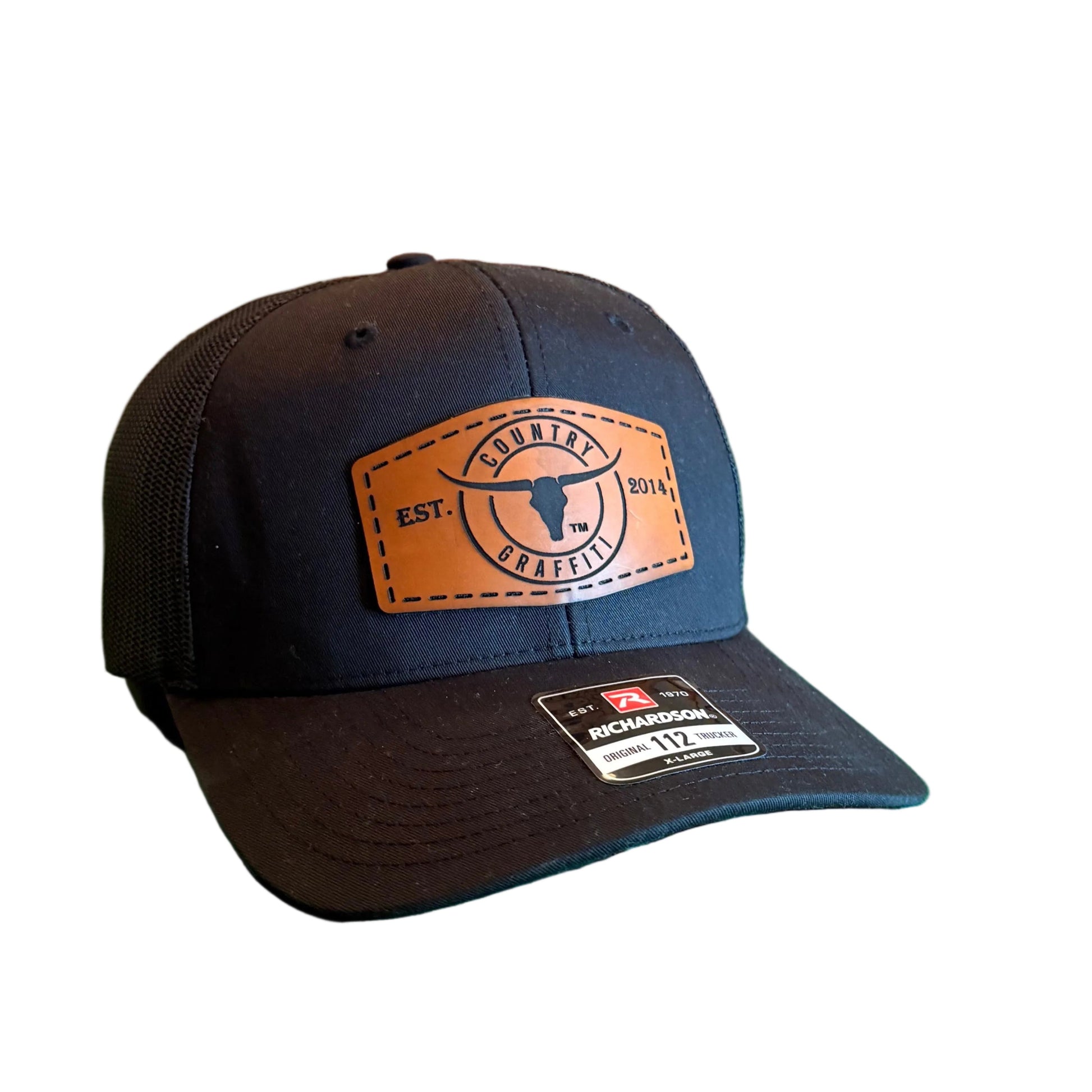 A dark navy baseball cap with a tan leather patch logo.