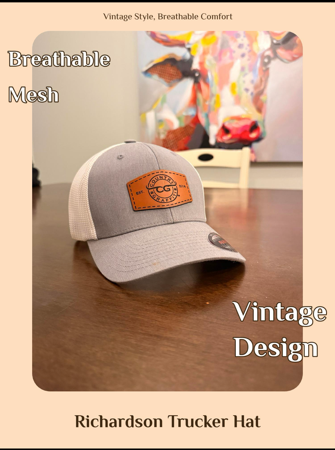 A Richardson trucker hat with a light gray front panel and a brown leather patch on the front